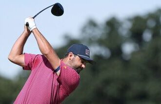 Scottie Scheffler of the US Team plays his shot from the sixth tee during Sunday's Singles on day four of the Presidents Cup 2026 at Medinah Country Club on September 27, 2026 in Medinah, Illinois.