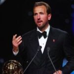 Bayern Munich's Harry Kane makes a speech after winning the men's Ballon d'Or award.