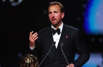 Bayern Munich's Harry Kane makes a speech after winning the men's Ballon d'Or award.