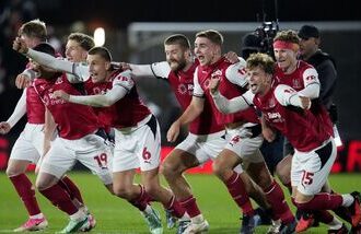 Fleetwood Town's players celebrate their win over Arsenal in the fourth round of the Carabao Cup on Tuesday.
