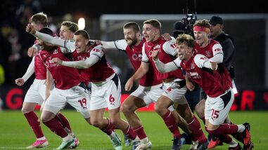 Fleetwood Town's players celebrate their win over Arsenal in the fourth round of the Carabao Cup on Tuesday.