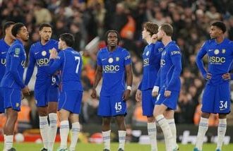 Chelsea players look dejected after losing 6-5 to Liverpool via penalties in the fourth round of the Carabao Cup in Liverpool on Wednesday.
