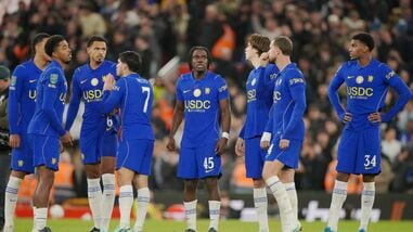 Chelsea players look dejected after losing 6-5 to Liverpool via penalties in the fourth round of the Carabao Cup in Liverpool on Wednesday.