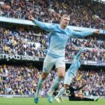 Manchester City's Erling Haaland celebrates scoring their third goal.