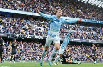 Manchester City's Erling Haaland celebrates scoring their third goal.