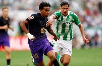 FC Barcelona's Lamine Yamal in action with Real Betis' Facundo Bernal