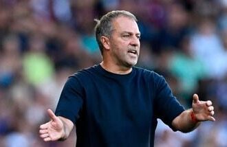 FC Barcelona coach Hansi Flick reacts