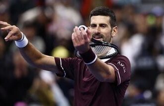 Novak Djokovic celebrates after winning his quarterfinal match against Germany's Alexander Zverev