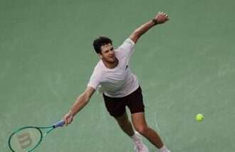 Poland's Hubert Hurkacz in action during his round of 64 match against Serbia's Novak Djokovic.