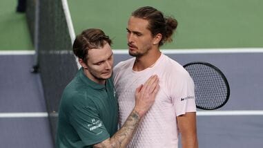 Germany's Alexander Zverev embraces Kazakhstan's Alexander Bublik after winning his round of 16 match.