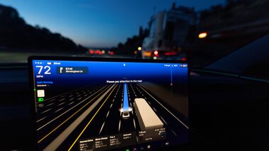 A display of a Tesla Model 3 using Full Self-Driving Supervised.