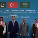From center, Turkish Foreign Minister Hakan Fidan poses for a family photo with Pakistan's Foreign Minister Ishaq Dar, right, Saudi Foreign Minister Prince Faisal bin Farhan Al Saud, second right, and senior military and civilian officials from Turkey, Pakistan and Saudi Arabia at the first meeting of the Strategic Political and Defense Committee established under the Makkah Joint Defence Agreement in Istanbul, Turkey, Monday, 31 August 2026. (AP Photo/Khalil Hamra)