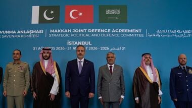 From center, Turkish Foreign Minister Hakan Fidan poses for a family photo with Pakistan's Foreign Minister Ishaq Dar, right, Saudi Foreign Minister Prince Faisal bin Farhan Al Saud, second right, and senior military and civilian officials from Turkey, Pakistan and Saudi Arabia at the first meeting of the Strategic Political and Defense Committee established under the Makkah Joint Defence Agreement in Istanbul, Turkey, Monday, 31 August 2026. (AP Photo/Khalil Hamra)