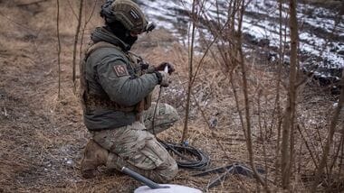 FILE PHOTO: A Ukrainian serviceman of 47th brigade prepares a Starlink satellite internet systems at his positions at a front line, amid Russia's attack on Ukraine, near the town of Avdiivka, recently captured by Russian troops in Donetsk region, Ukraine February 20, 2024. REUTERS/Inna Varenytsia/File Photo