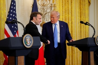 US President Donald Trump (right) shakes hands with French President Emmanuel Macron, during a press conference at the White House in Washington, DC, US, on February 24, 2025.