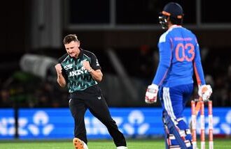 New Zealand's Nathan Smith (L) celebrates the wicket of India's Vaibhav Sooryavanshi during the second T20I.