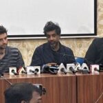 Former France international footballer Vikash Dhorasoo (C) speaks to the media at the Saltlake Stadium in Kolkata on Thursday.