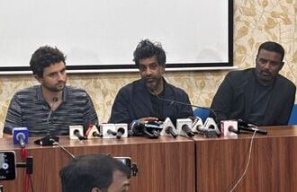 Former France international footballer Vikash Dhorasoo (C) speaks to the media at the Saltlake Stadium in Kolkata on Thursday.