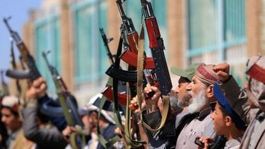 Fighters loyal to the Houthi authorities take part in a rally to recruit more fighters in Sanaa on October 7, 2026. The Houthis claimed a flurry of attacks on Saudi targets on October 7, including firing a ballistic missile at Riyadh airport, as the group battles for territory in Yemen against government forces supported by the kingdom. (Photo by Mohammed HUWAIS / AFP)